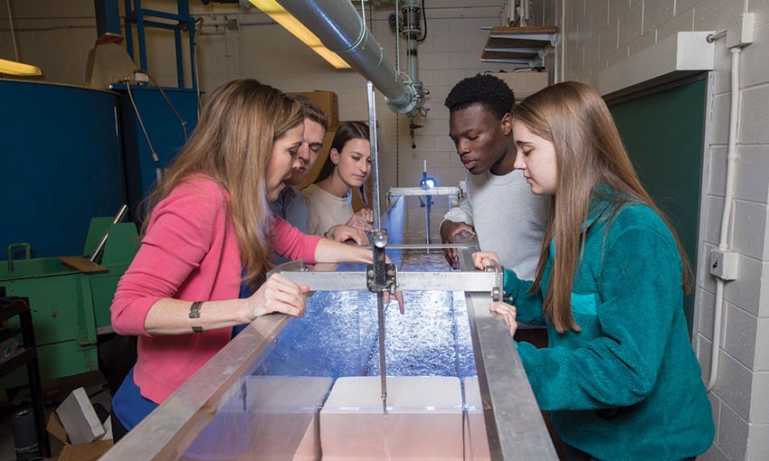 Villanova faculty member working with students in a hydrology and Hydrolics lab.